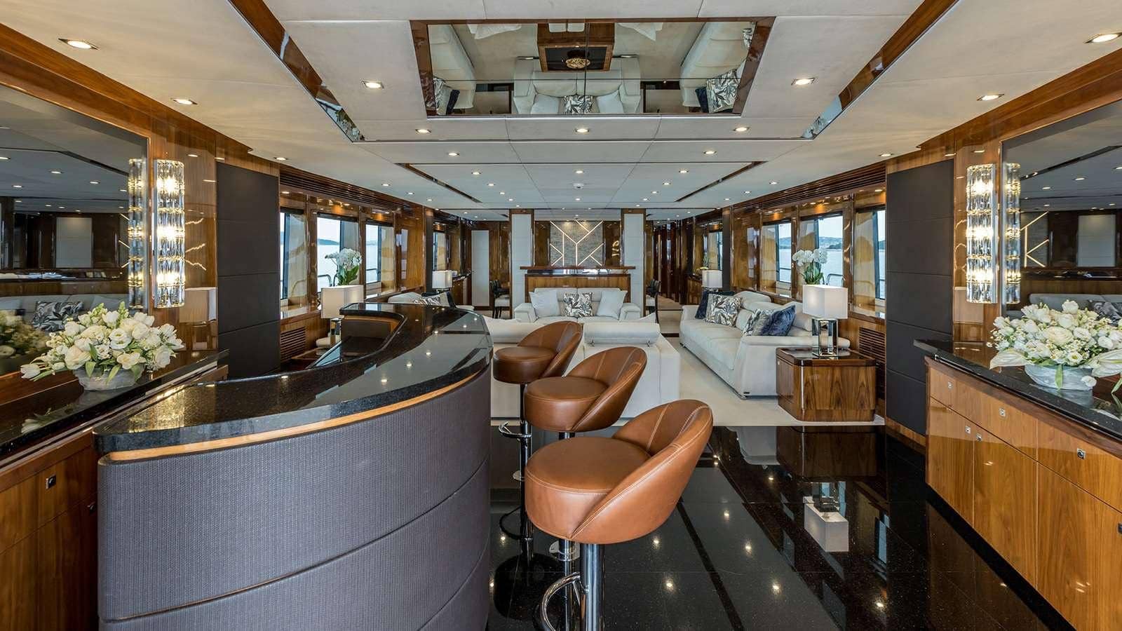 Sunseeker 37M main saloon bar with leather stools, walnut joinery
