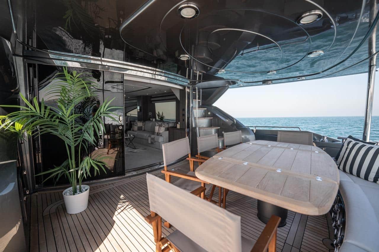 Sunseeker 82 Yacht aft deck dining open to the main saloon