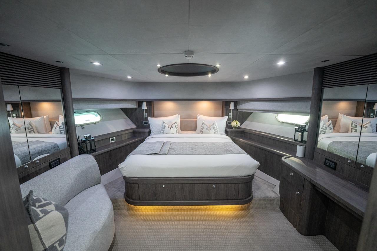 Sunseeker 82 Yacht full-beam master cabin with hull windows