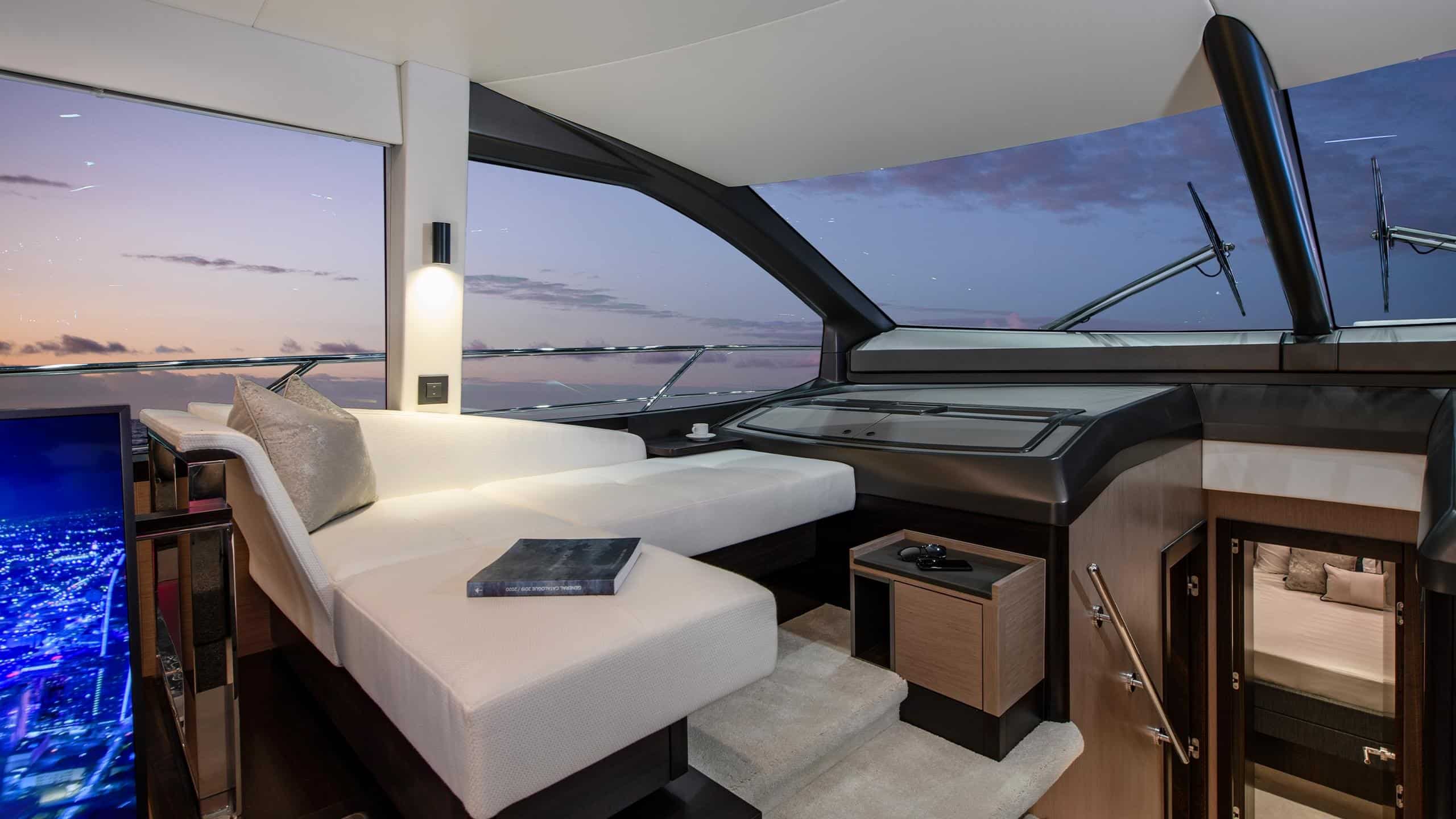 Sunseeker Manhattan 68 galley and dinette at dusk — shipyard photo