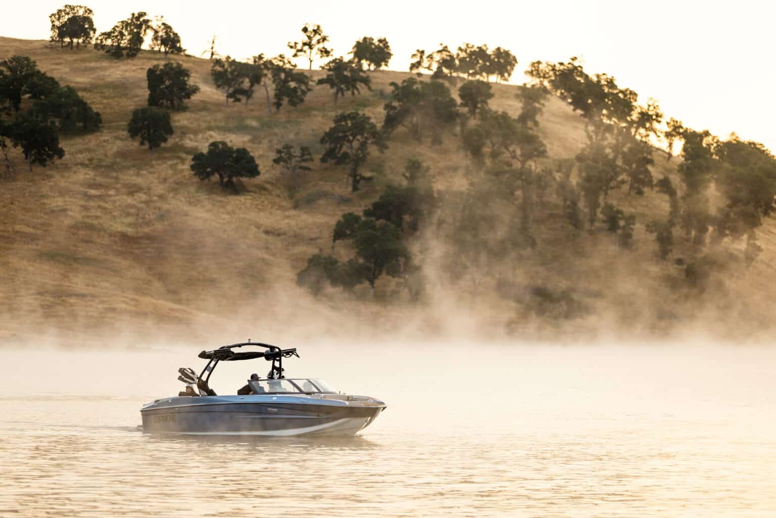 Supreme S240 on misty morning water, profile view — press photo