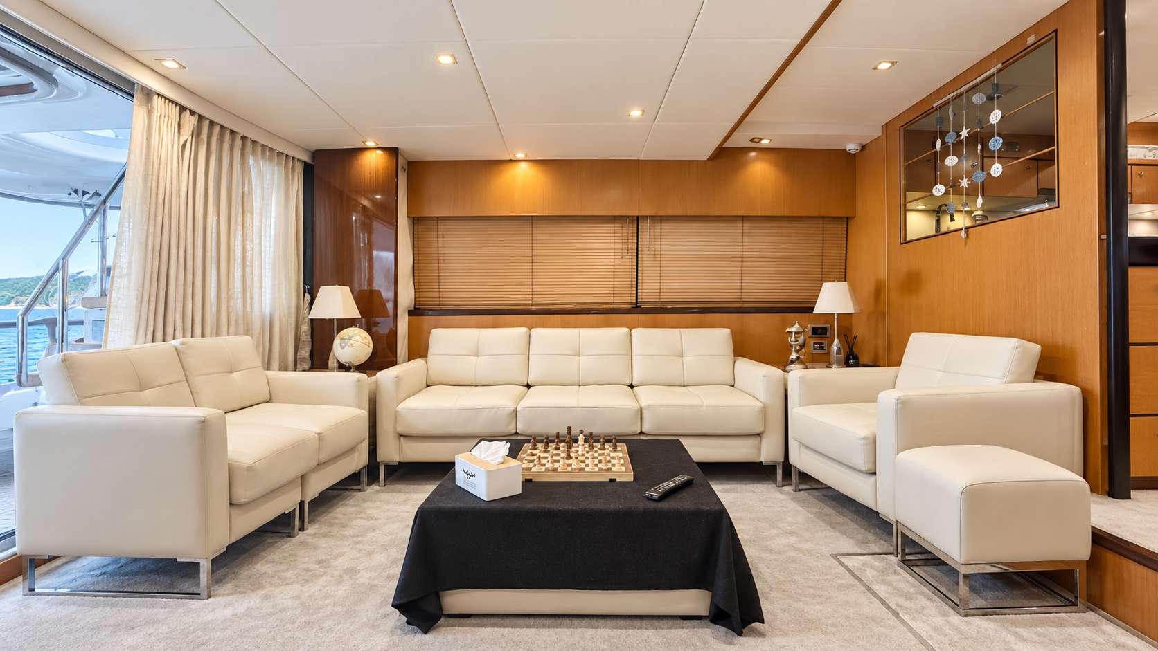Empress 80 main salon seating area with chessboard