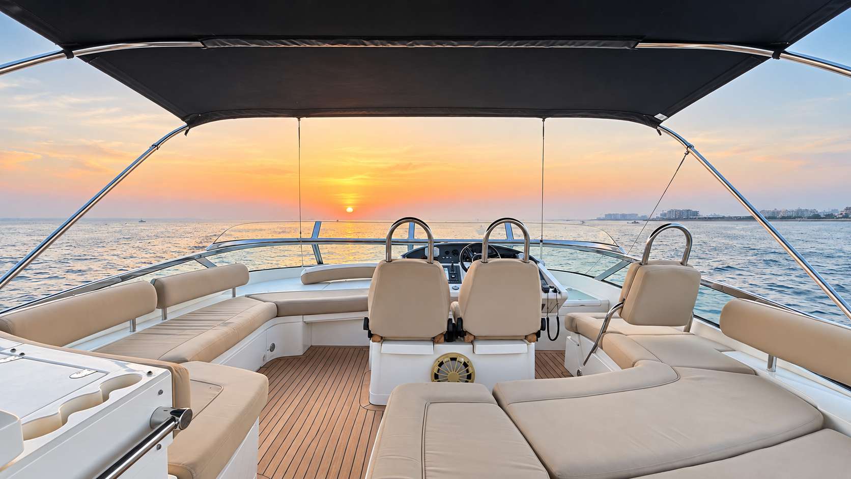 Empress 80 flybridge lounge at sunset on the open water