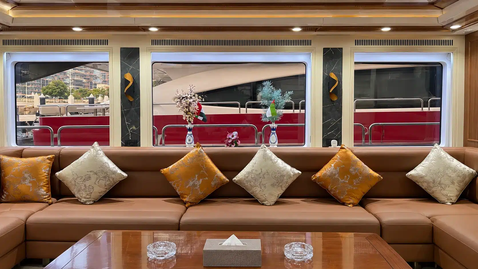 Benetti 120 yacht main salon sofa and panoramic windows