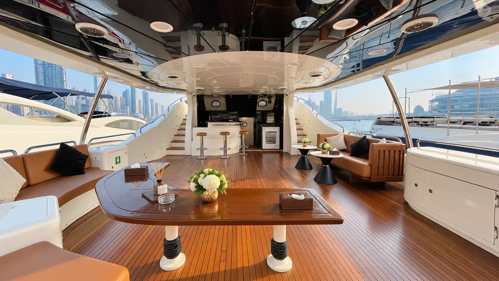 Benetti 120 yacht covered upper deck dining table